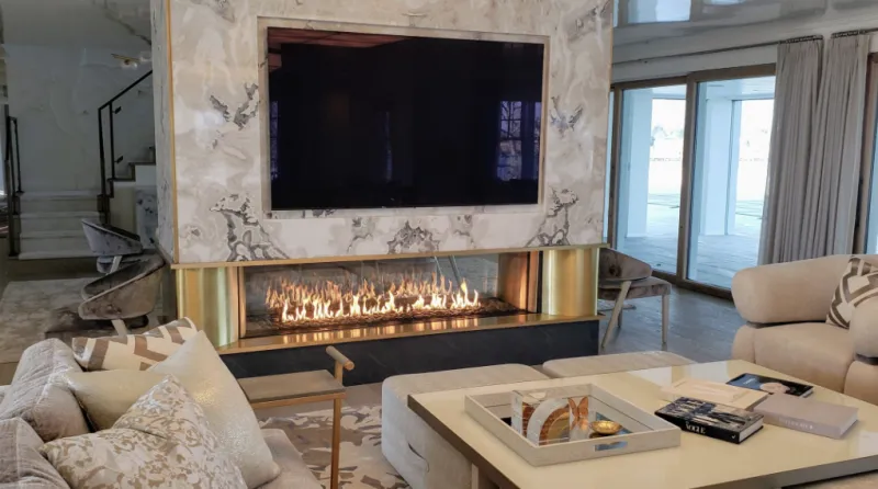 Acucraft see-through gas fireplace with tall flames in living room