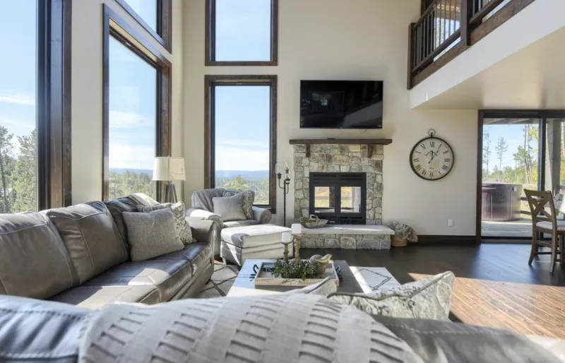 Acucraft Hearthroom wood-burning fireplace with stone surround and TV above