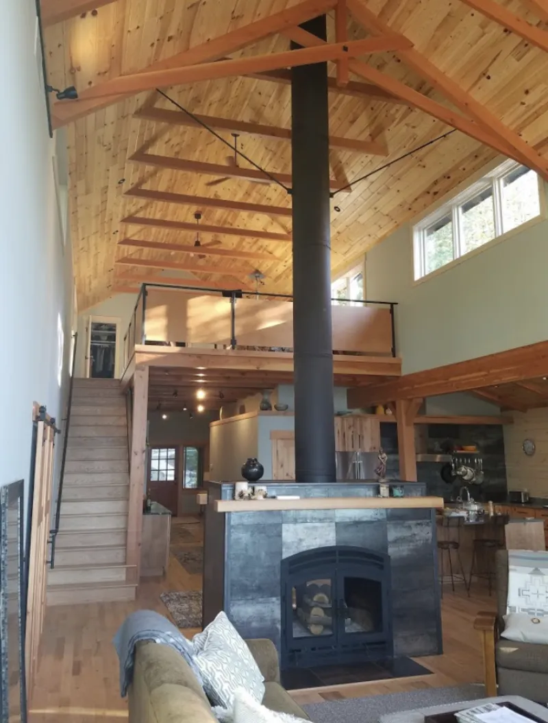 Acucraft Hearthroom wood-burning fireplace in timber-frame lodge