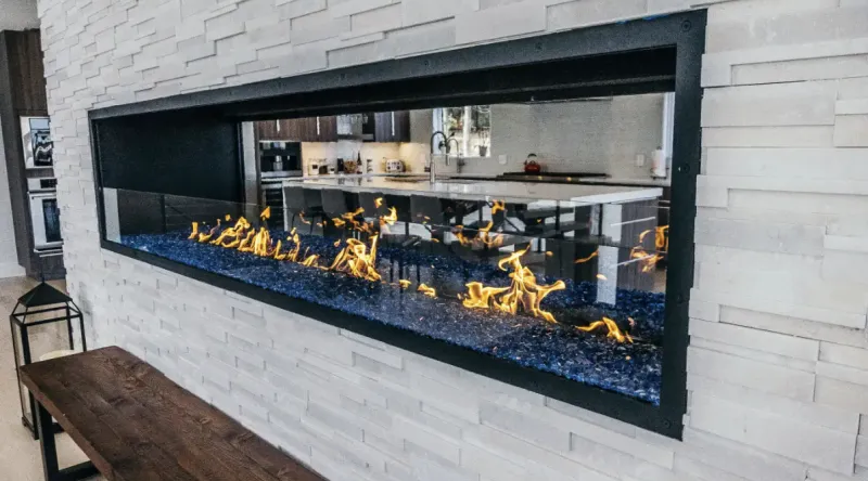 Acucraft see-through gas fireplace indoor-outdoor installation
