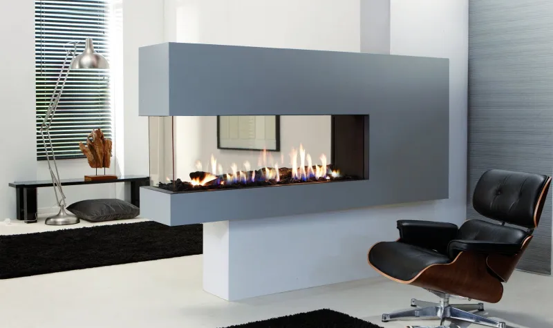 Element 4 Lucius 140 three-sided peninsula fireplace with Eames chair