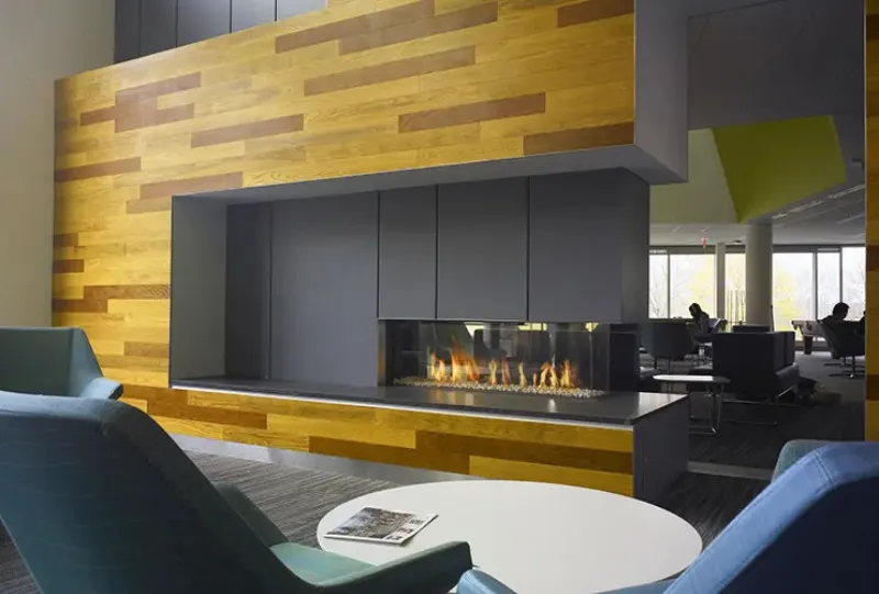 Element 4 Lucius 140 wide linear fireplace in commercial lobby with wood wall