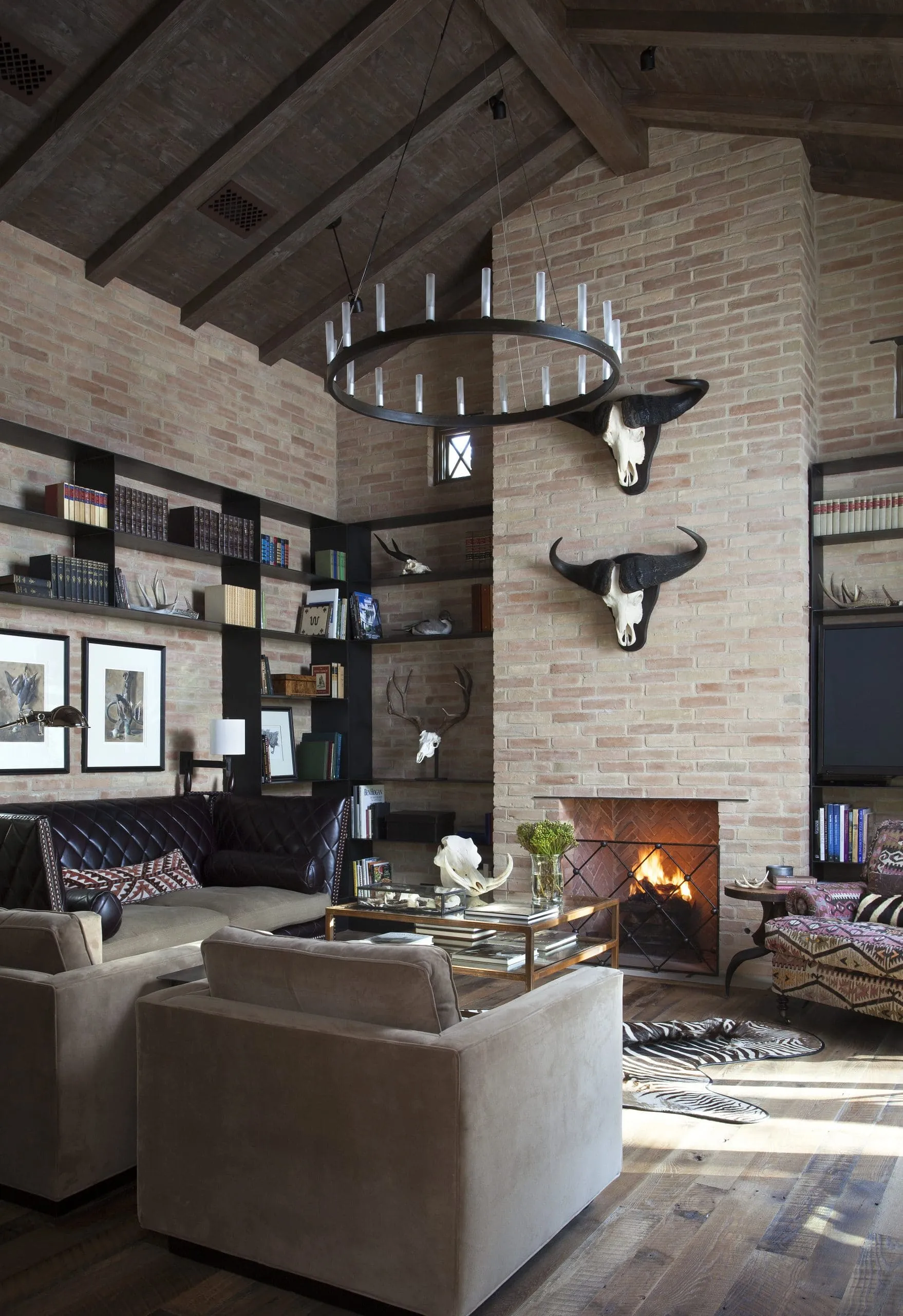 Isokern Magnum Series fireplace in dramatic brick living room with vaulted ceiling