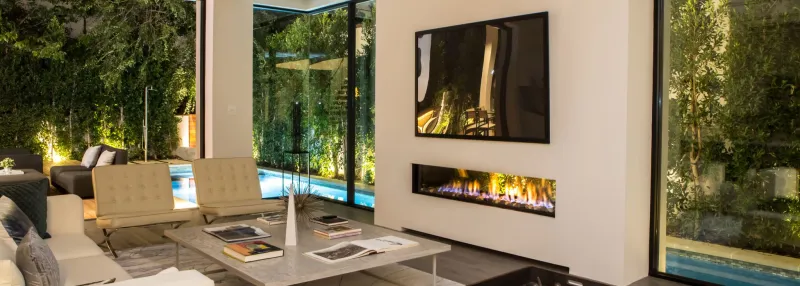 Ortal Indoor Outdoor Tunnel fireplace bridging interior and exterior