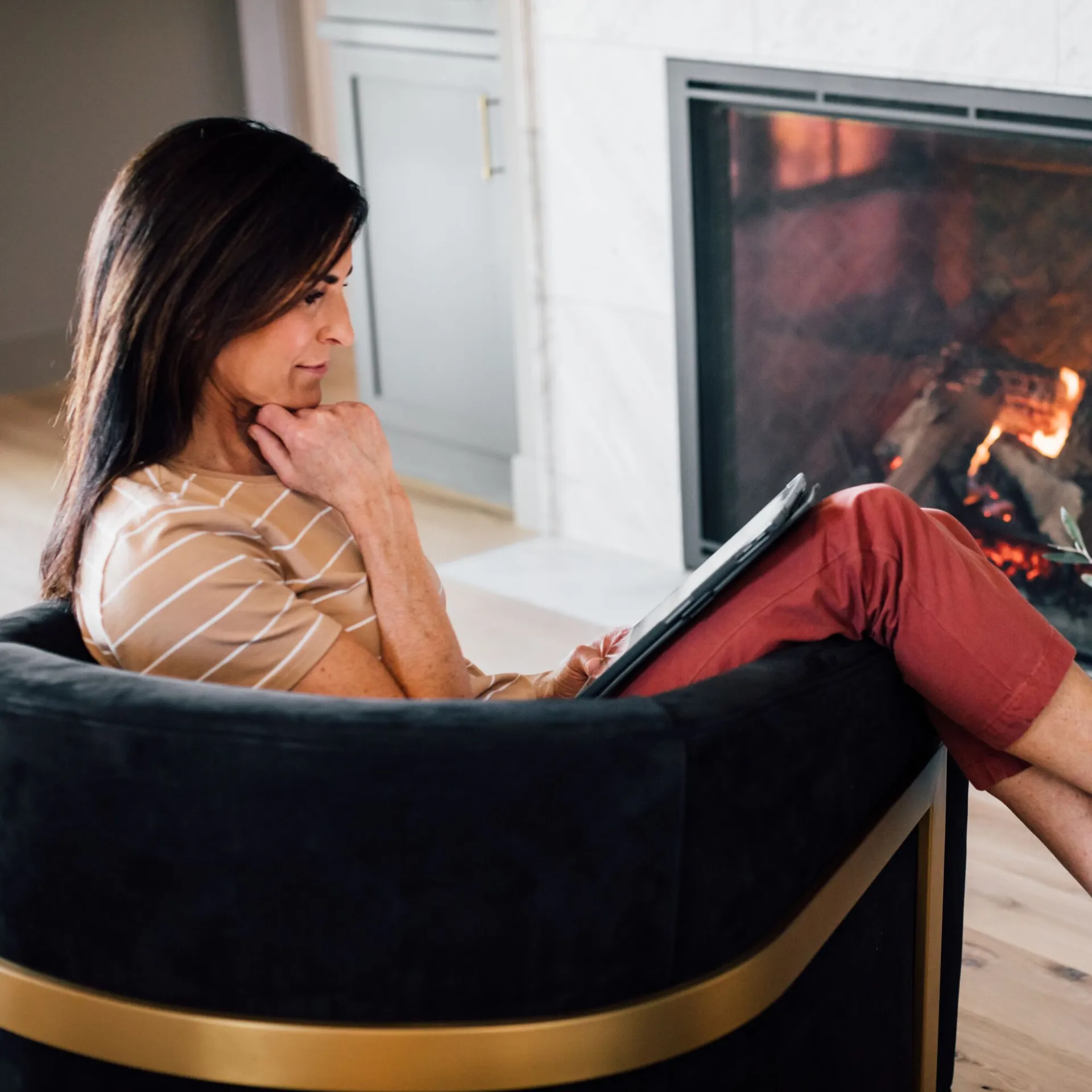 Fireplace with custom cabinetry and glass doors